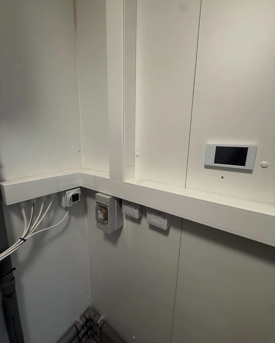 Electrical controls installed inside a utility cupboard