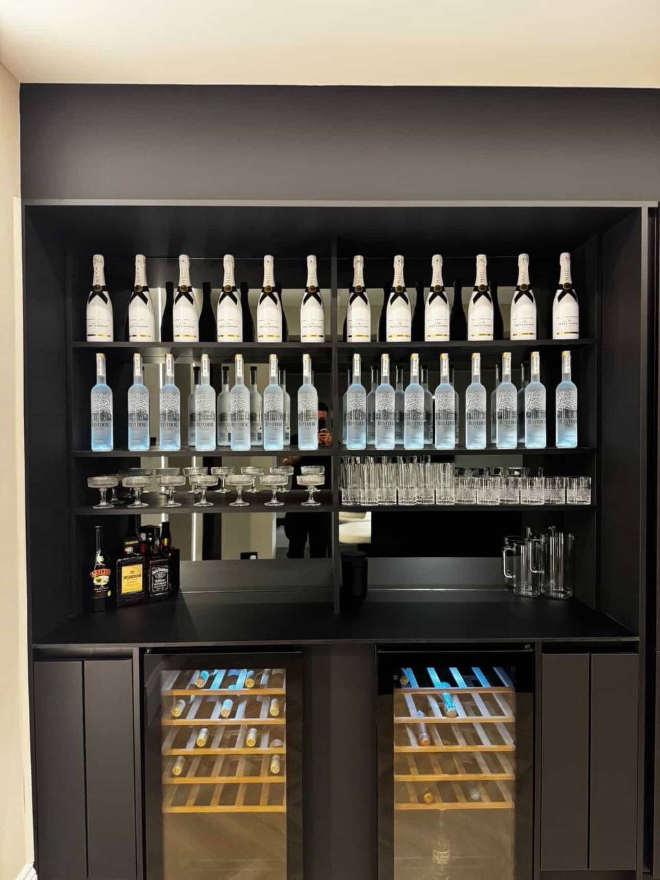 Illuminated drinks station with glass shelving and integrated wine fridges